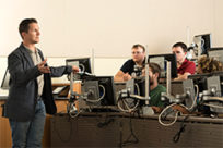 Thomas Wallace, a senior instructor and program coordinator, teaching a small information science class.