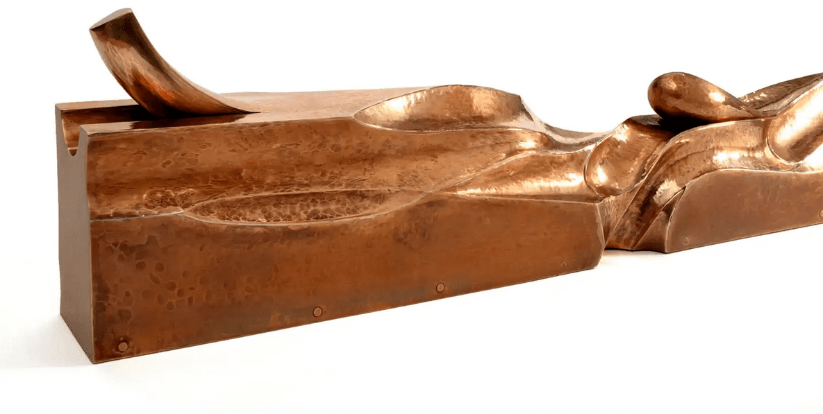 Sheet bronze formed into a table-top sculpture.