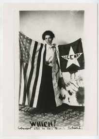 image of Activist Bernie Babcock holds a suffrage banner and American flag. Bernie Babcock Photograph Collection, UALR.PH.0060. 