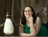 image of graduate assistant Jessica Erwin who is receiving the Public History Graduate Student of the Year award is with an African penguin on March 15, 2016. She worked at the LR Zoo where she was the project manager for the Public History Seminar course during the fall of 2015 (the class writes a history of a selected institution every other year).