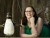 image of graduate assistant Jessica Erwin who is receiving the Public History Graduate Student of the Year award is with an African penguin on March 15, 2016. She worked at the LR Zoo where she was the project manager for the Public History Seminar course during the fall of 2015 (the class writes a history of a selected institution every other year).