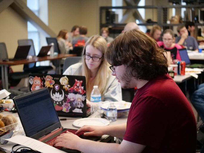 The department consistently updates its job opportunities page. Pictured are computer science students.