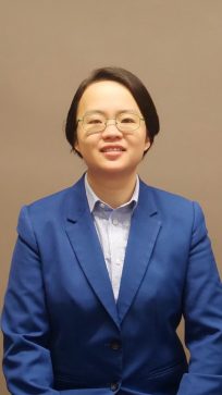 Professional headshot of Dr. Phuong Tran, assistant professor in the Department of Computer Science. 