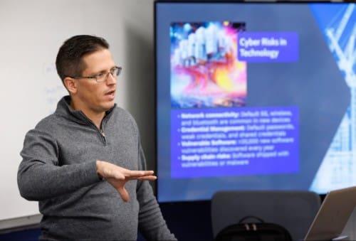 dr phillip huff presenting on cyber security risks