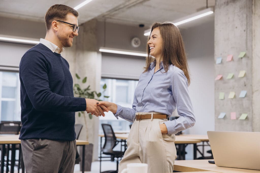 hr-professional-shaking-hands-with-employee-smiling