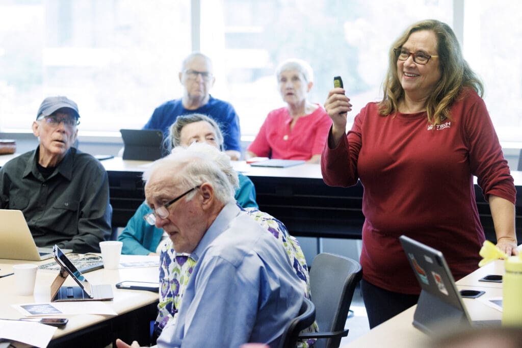 Marla Johnson teaches a class of Basics of AI Learners.