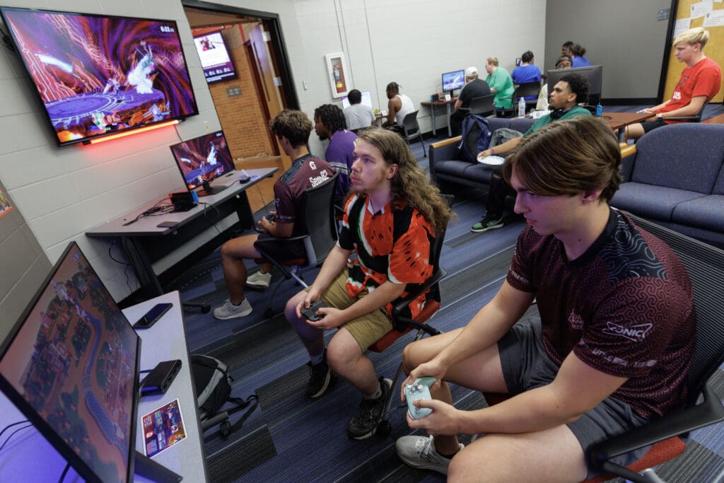 Students participate in an open house of the new Esports Club space, a renovated room in the ETAS building with several video game consoles. Members of the UA Little Rock Esports team competes online with other university teams nationwide.
Photo by Benjamin Krain