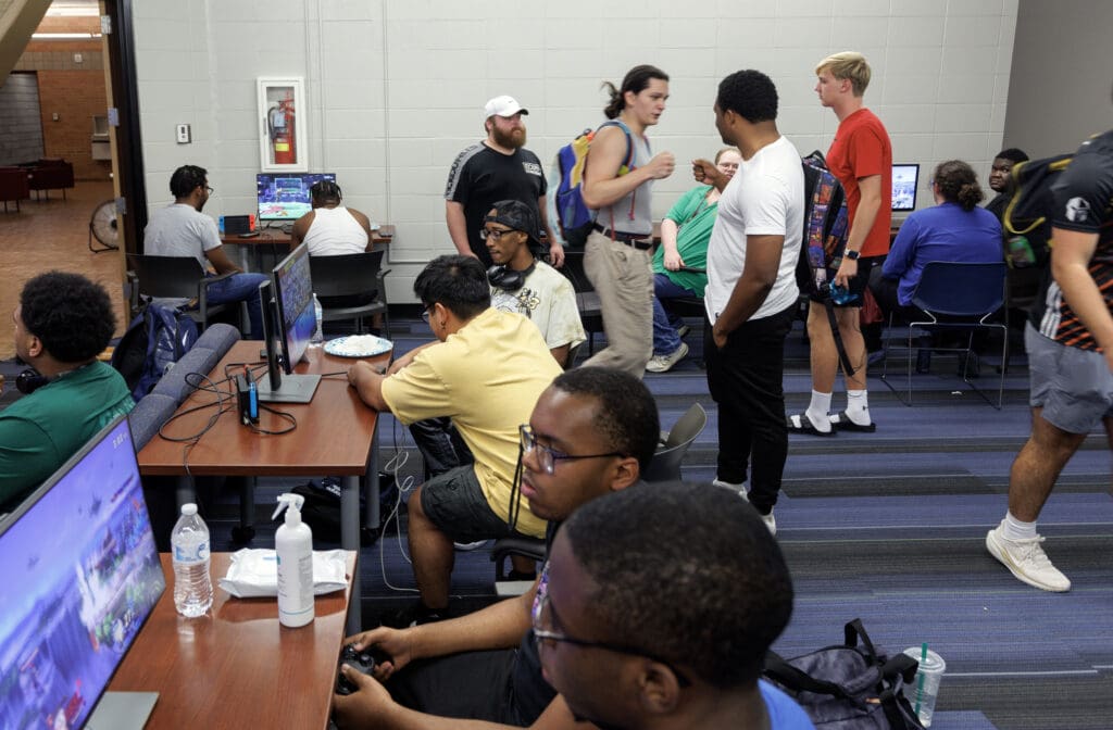 Students participate in an open house of the new Esports Club space, a renovated room in the ETAS building with several video game consoles. Members of the UA Little Rock Esports team competes online with other university teams nationwide.
Photo by Benjamin Krain