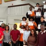 national society of black engineer ua little rock members with students posing for group photo