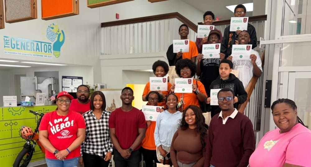 national society of black engineer ua little rock members with students posing for group photo