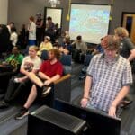 students conversating and playing video games in the esports lounge