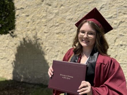 Young woman with diploma