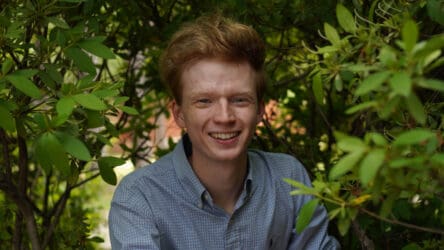 Red haired man in bushes