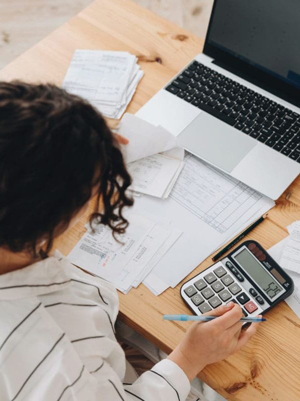 woman-using-calculator-for-accounting