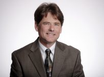 Staff headshot of Stephen Grace, 2023 Faculty Excellence award for Public Service