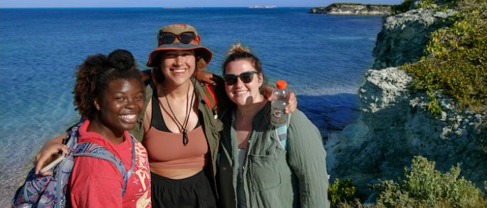 Three smiling Geology students. Contact faculty to learn more.