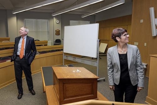 Bowen alum Wylie Cavin III (left) and Bowen Dean Theresa Beiner (right) tour the William H. Bowen School of Law. Photo by Ben Krain.