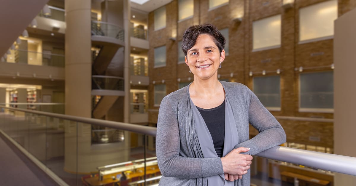 Rachel Fazio standing inside the library at the UA Little Rock William H. Bowen School of Law