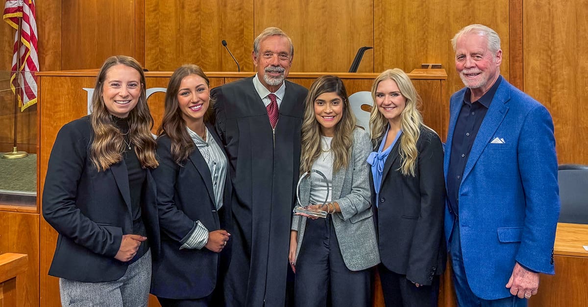 Members of the Bowen Law Mock Trial team along with professor Pat Harris and presiding judge