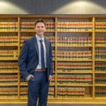 UA Little Rock William H. Bowen School of Law student Justin Maggerise stands in the faculty library.