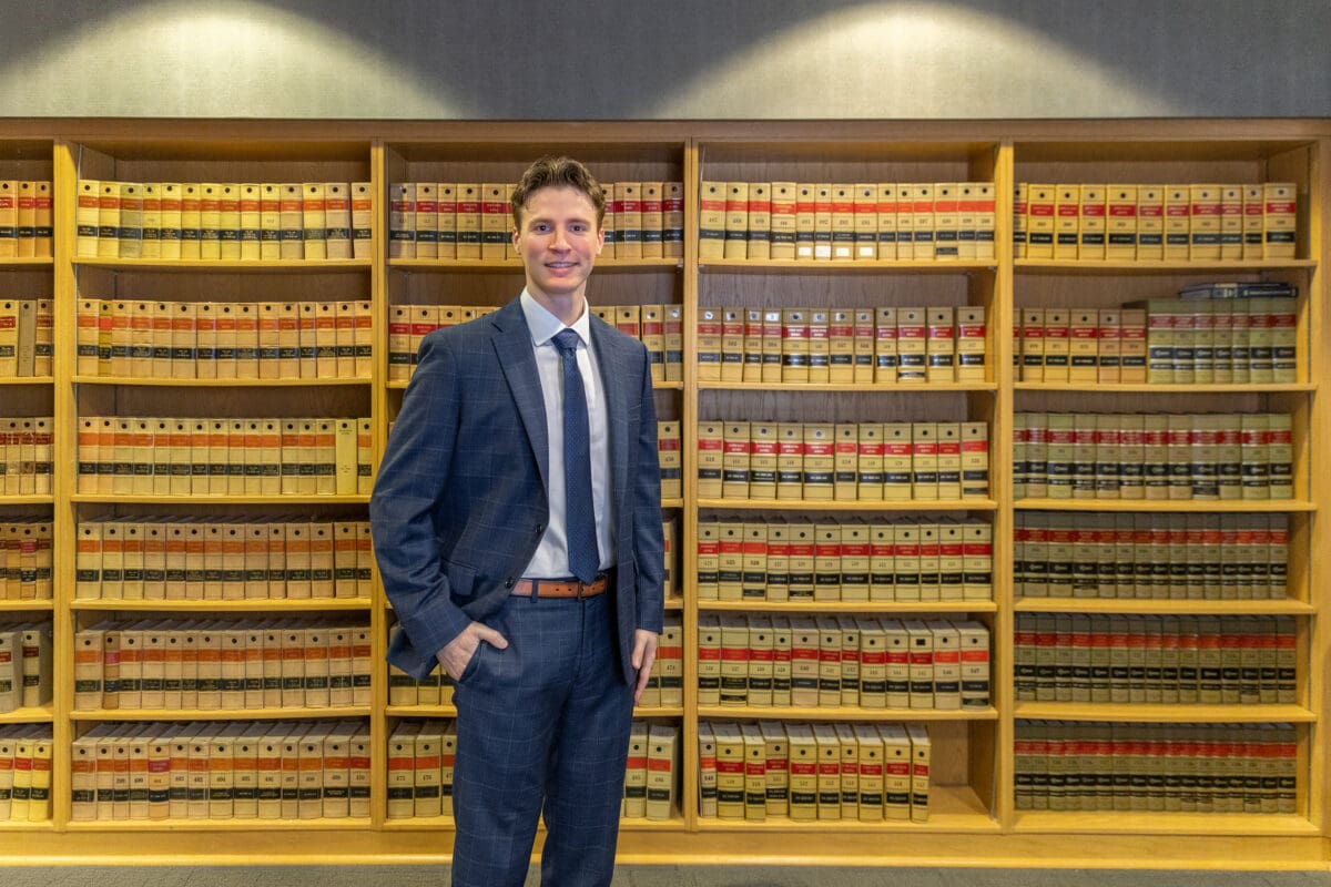 UA Little Rock William H. Bowen School of Law student Justin Maggerise stands in the faculty library.