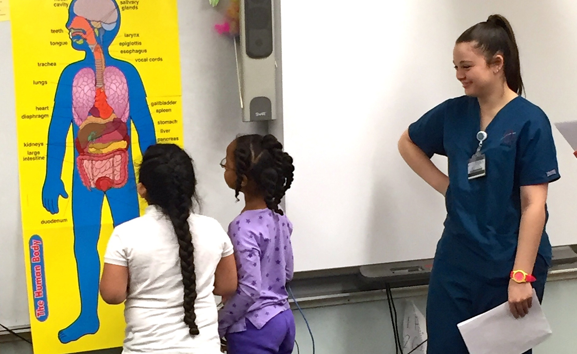 UALR nursing student Jessica Bell teaches Little Rock elementary students about nutrition as part of the Love Your Schools project.