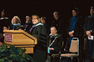 Assistant Vice Chancellor for Student Life and Leadership Development Dr. Jan Austin speaks during the UALR Freshman Convocation.