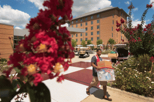 Volunteers carry containers Aug. 12 during UALR's move-in day.