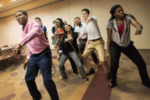 Resident assistants dance during a team-building exercise