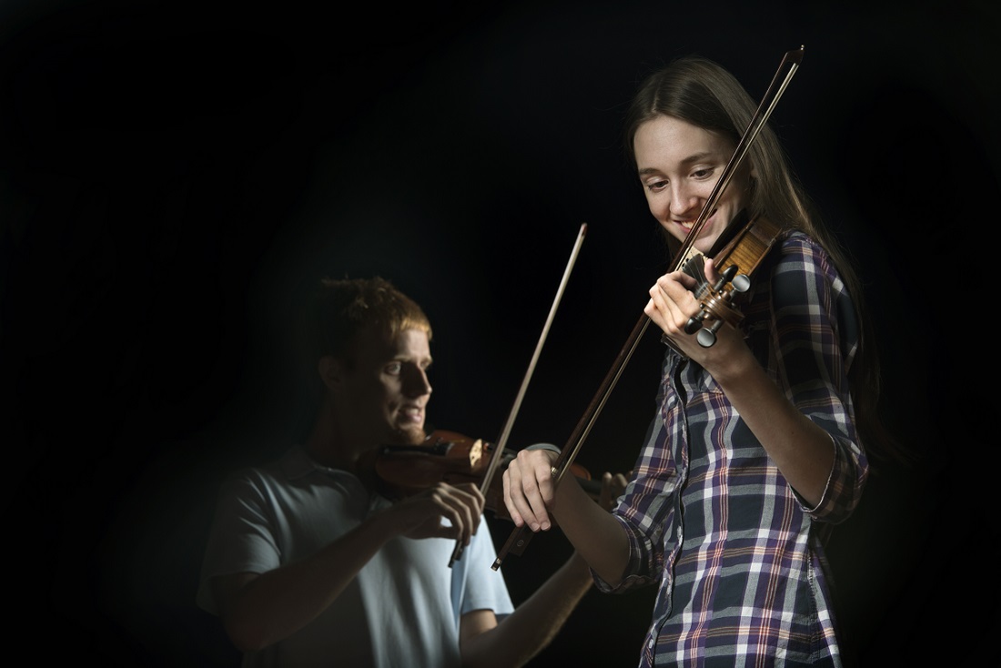 UALR students and traditional-style fiddlers Emily Phillips and Everett Elam photographed on Sept. 8, 2015, at Stella Boyle.