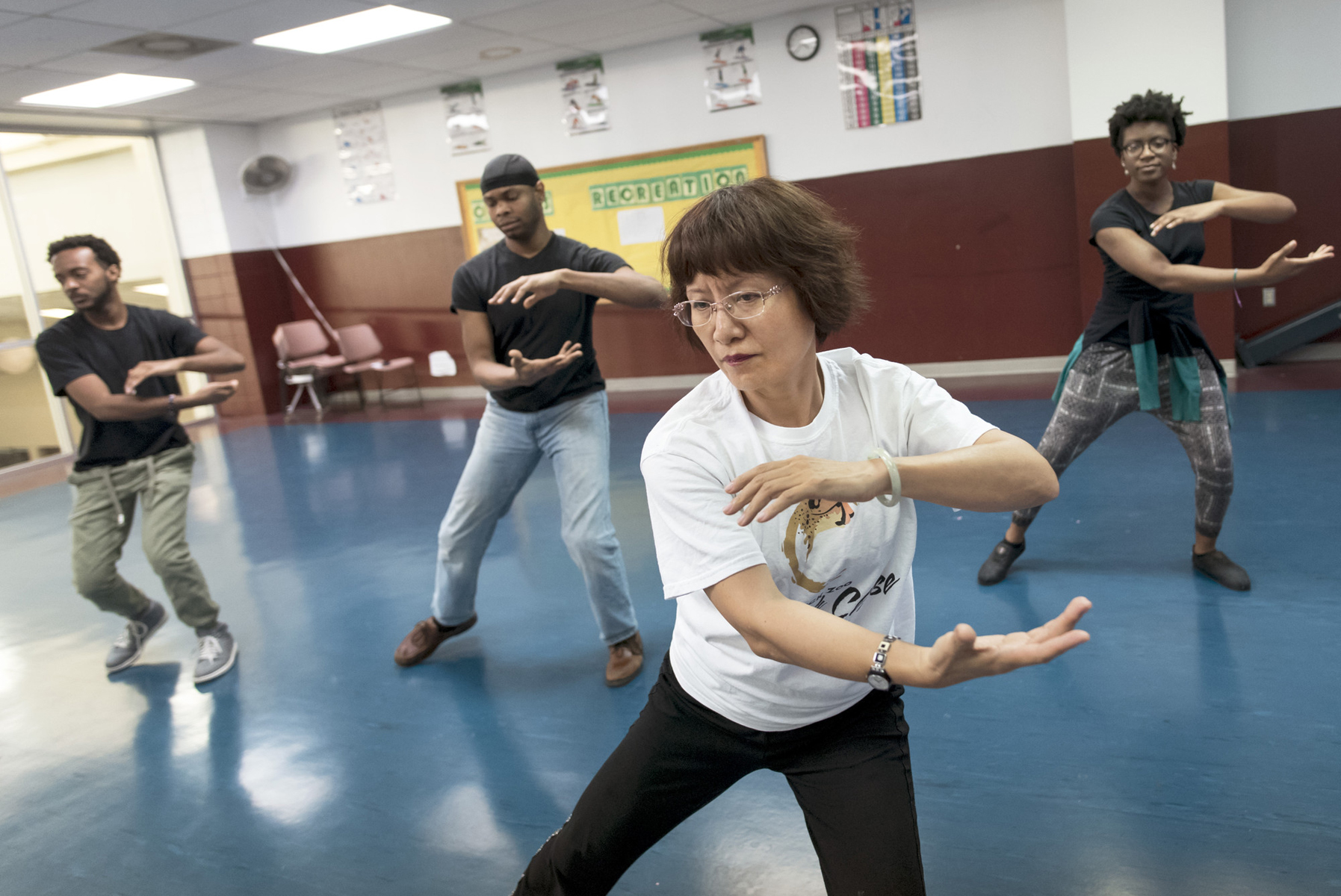 Visiting scholar, Huang Li, from Huaxia University in Xiamen, China teaches tai chi for the fitness center on Jan. 20, 2016, in DSC. Tai chi is an ancient Chinese tradition that, today, is practiced as a graceful form of exercise. It involves a series of movements performed in a slow, focused manner and accompanied by deep breathing.
