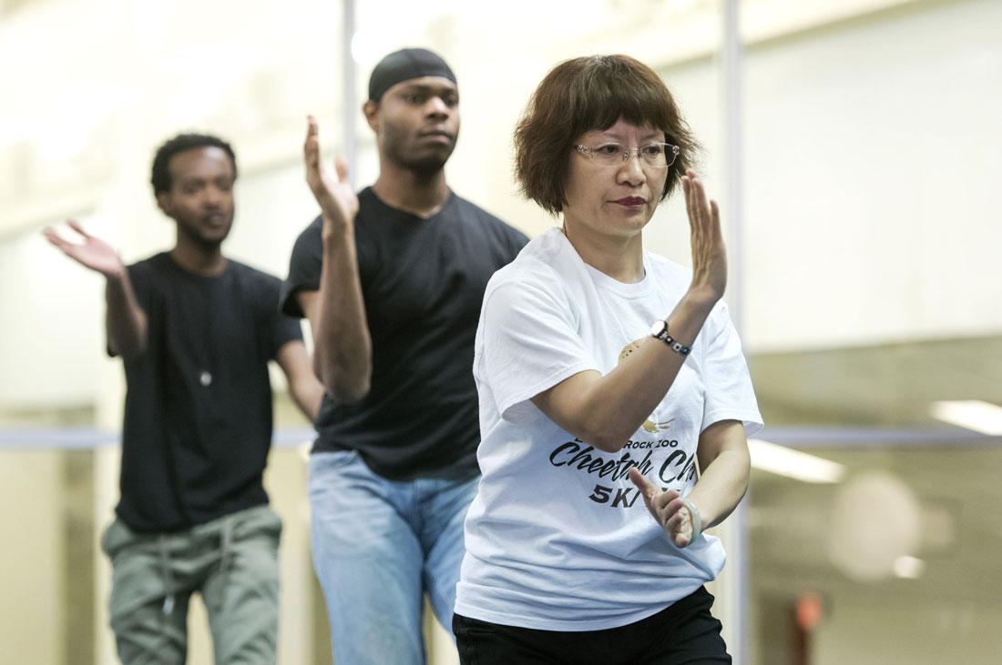 Visiting scholar, Huang Li, from Huaxia University in Xiamen, China teaches tai chi for the fitness center on Jan. 20, 2016, in DSC. Tai chi is an ancient Chinese tradition that, today, is practiced as a graceful form of exercise. It involves a series of movements performed in a slow, focused manner and accompanied by deep breathing.