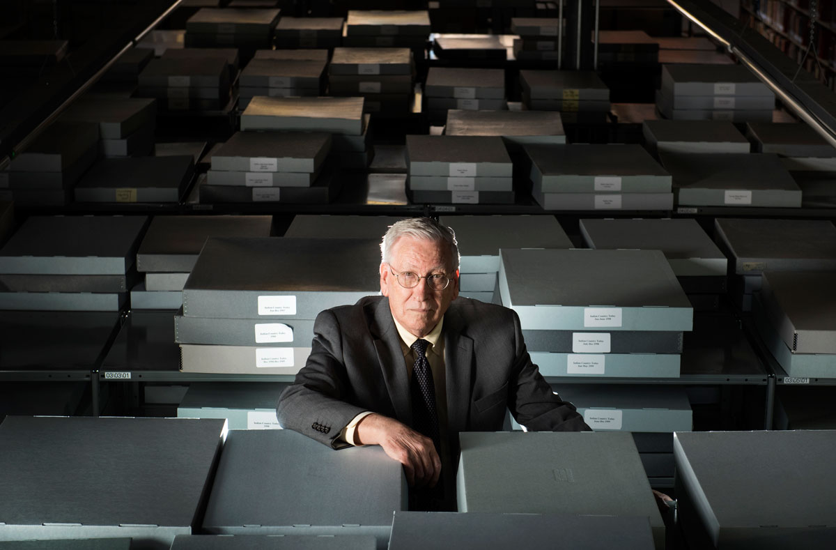 Daniel Littlefield sits among boxes of files at the UALR Sequoyah National Research Center, which will soon be home to one of the largest public collections of Alaska Native videos in the world.