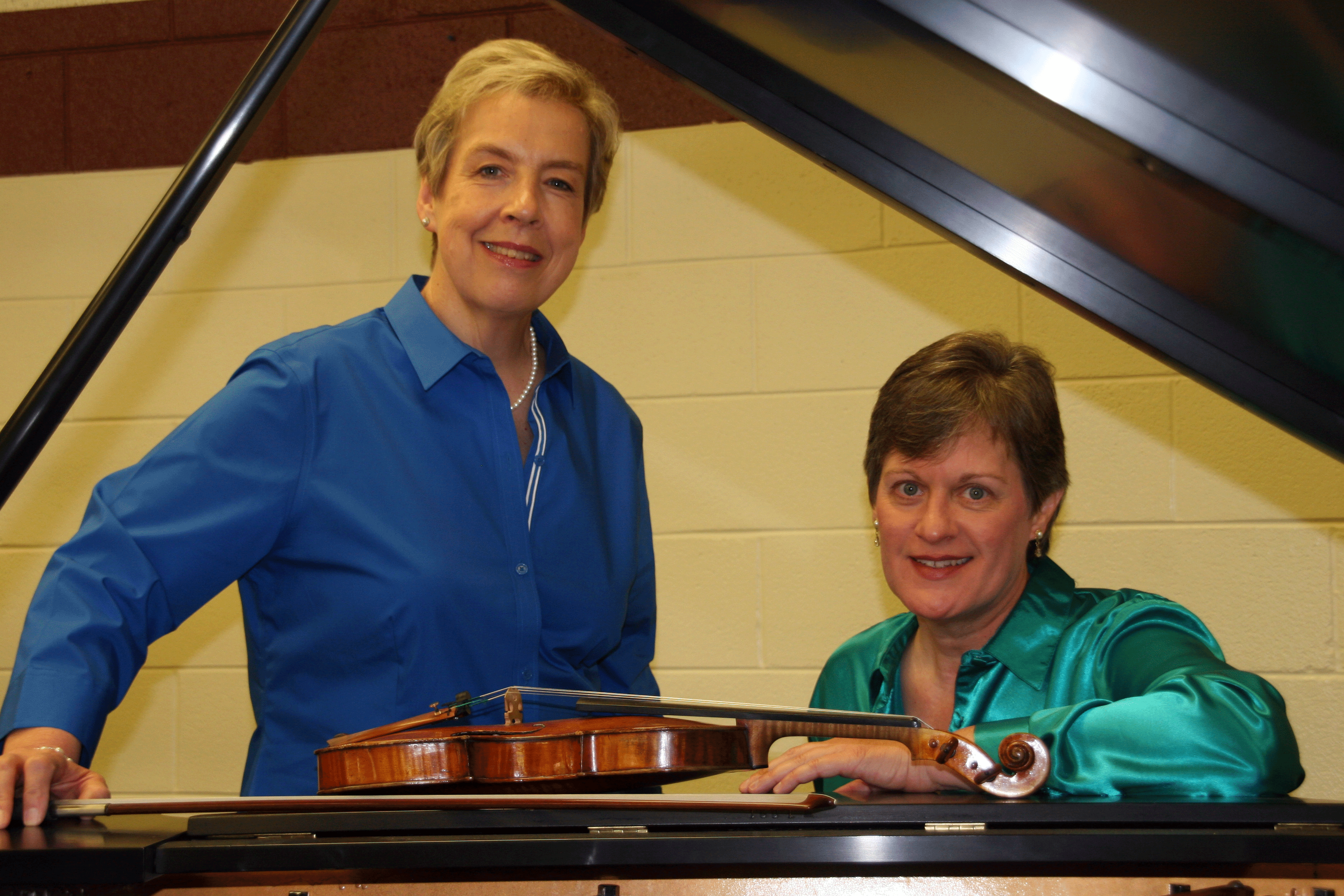 Mariposa consists of violinist Sandra McDonald (left), and violinist Linda Holzer (right). Photo by Peggy Harstvedt.
