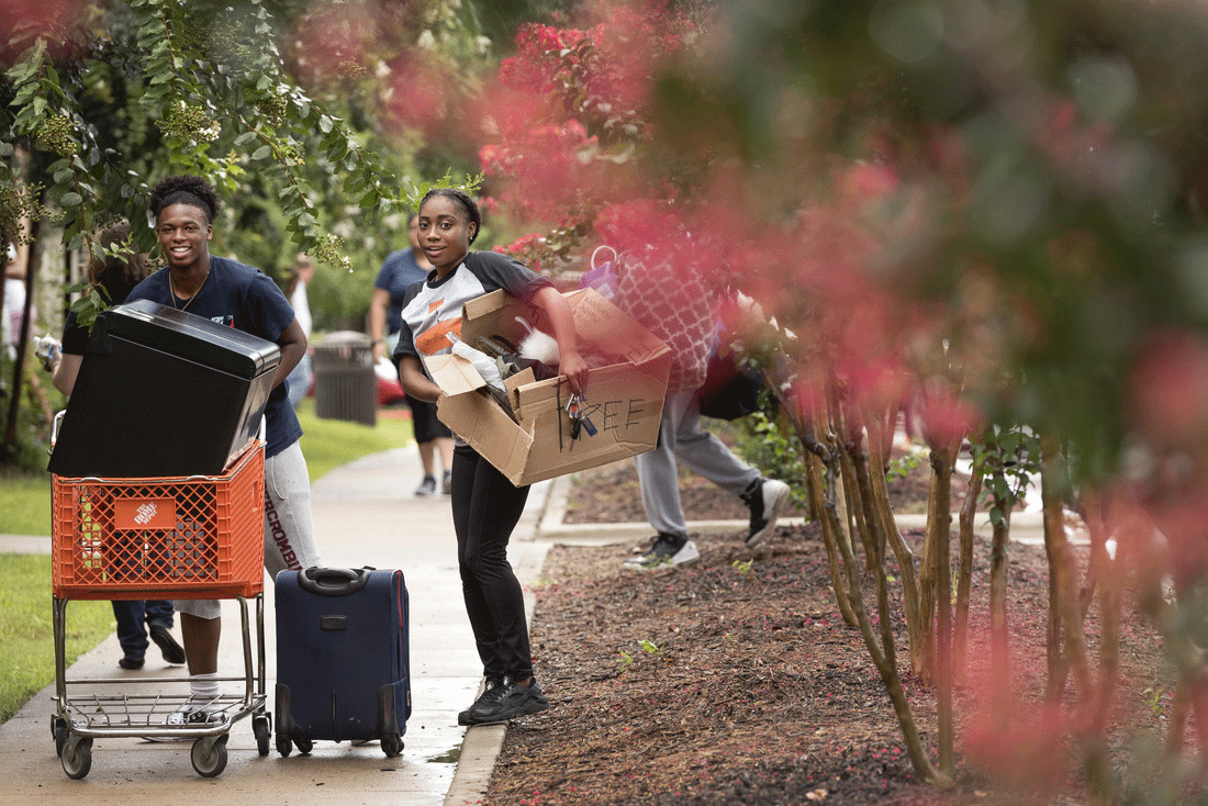 Two UALR students move into the residential halls during move-in day Saturday, August 13. Photo by Lonnie Timmons III/UALR Communications.