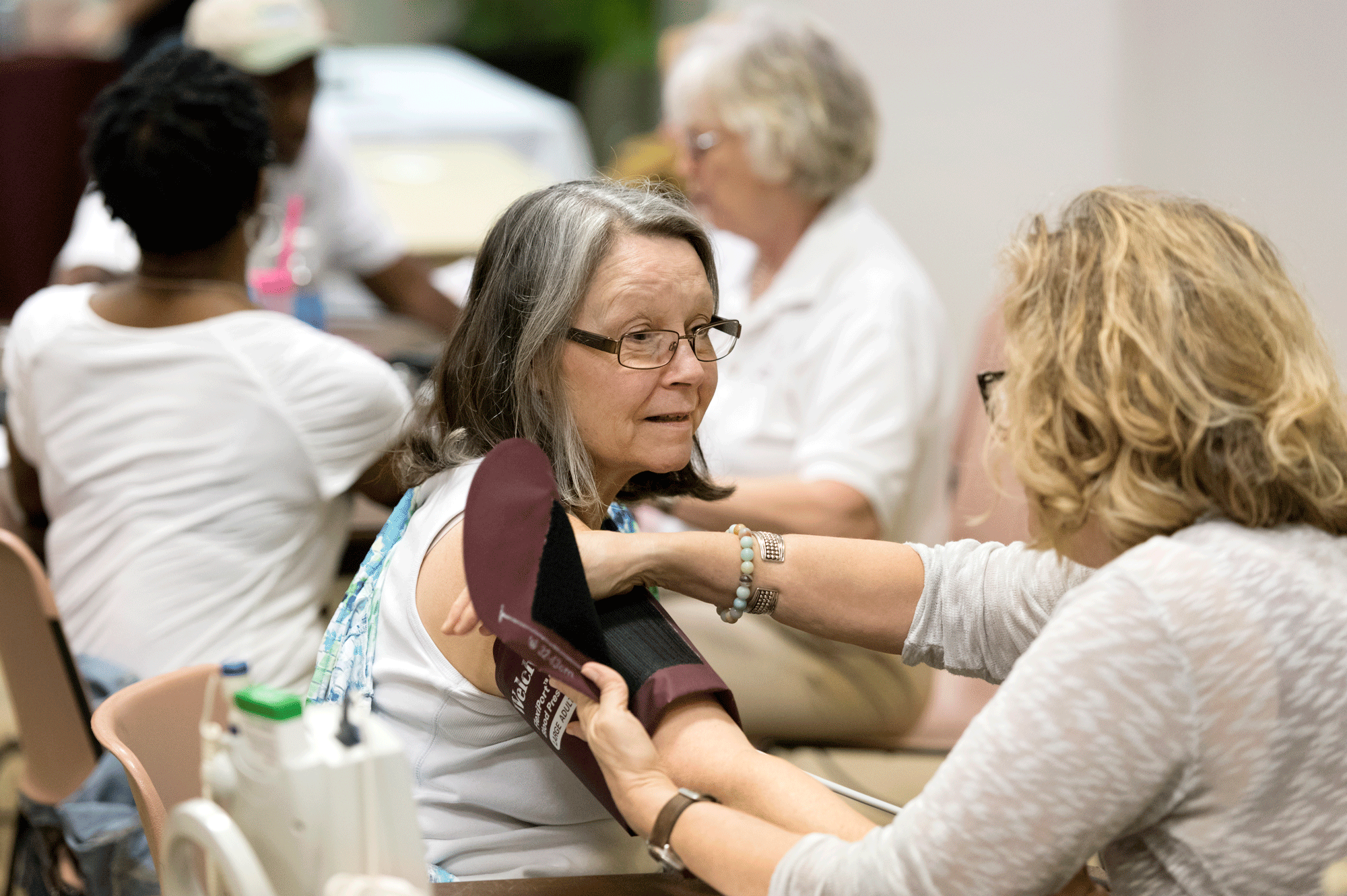 A UALR employee has her blood pressure taken at the Employee Wellness Fair on July 27. Photo by Lonnie Timmons III/UALR Communications.