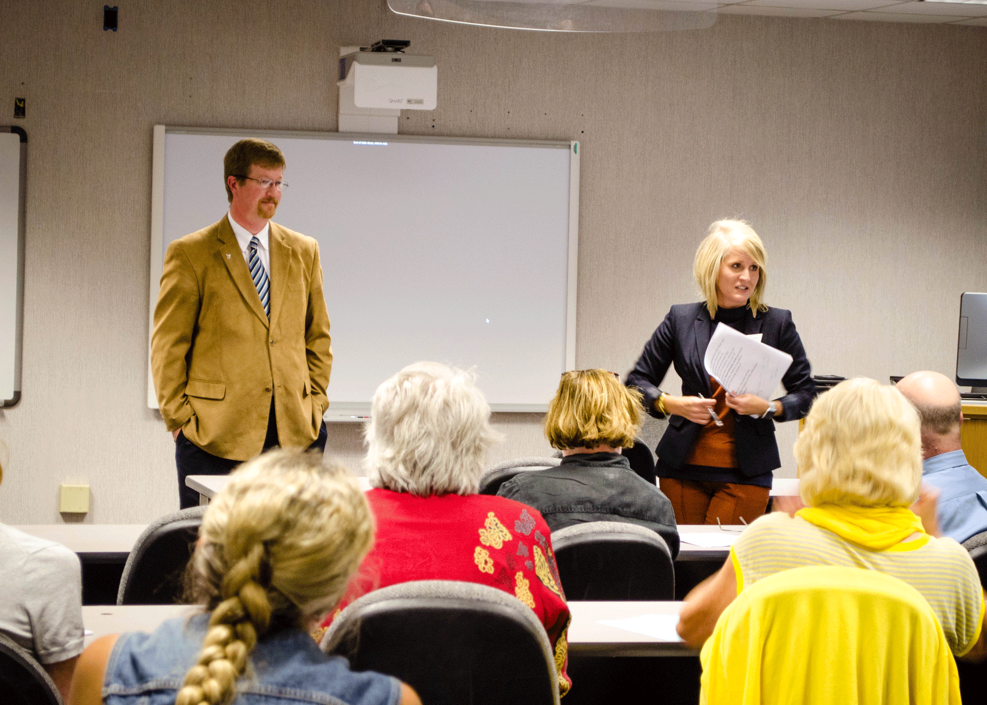 Arkansas Department of Education Commissioner Johnny Key (left) and Assistant Commissioner Ivy Pfeffer (right) discuss the state of education in Arkansas with UALR education faculty Sept. 22. Photo by Brad Sims.