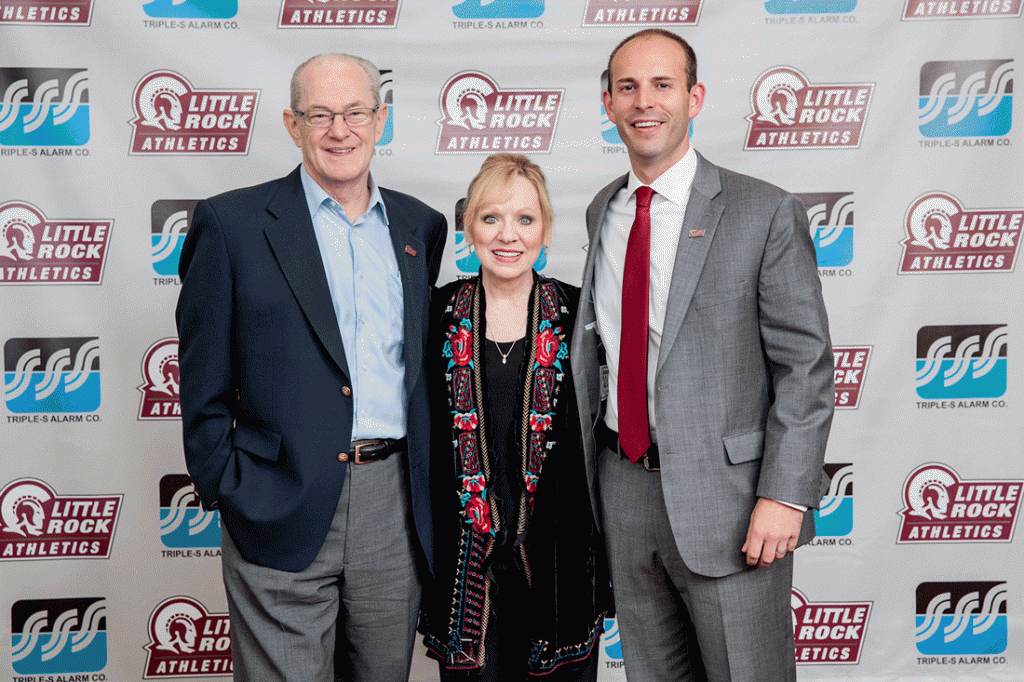 SpectacUALR's honorees, Greg and Marilyn Brown, are photographed with Athletics Director Chasse Conque. 