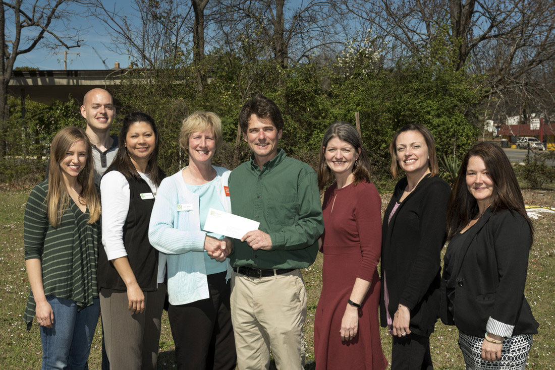 Pictured from left to right are Amber Mitchell, president of the Campus Garden Alliance, John Poole, Campus Garden Alliance member, Temeka Williams, operations director of the Arkansas Hunger Relief Alliance, Patty Barker, director of the Arkansas No Kids Hungry Campaign, Stephen Grace, professor of biology and Campus Garden Alliance faculty advisor, Betsy Hart, director of the Trojan Food Pantry, Whitney Bradford, assistant director of the Trojan Food Pantry, and Sarah Beth Estes, director of the Community Connections Center. Photo by Lonnie Timmons III/UA Little Rock Communications.
