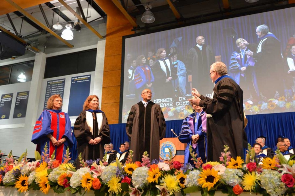 Dr. Glenn Anderson (middle) receives an honorary degree at Gallaudet University on May 12. Also pictured, from left to right, are Dr. Carol Erting, provost; Tiffany Williams, chair of the Gallaudet Board of Trustees; Gallaudet President Roberta Cordano; and Dr. Tom Humphries, member of the Board of Trustees. Photo by Zhee Chatmon of Gallaudet University.
