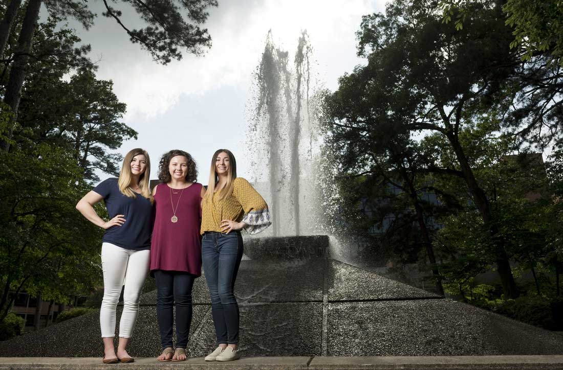 Three sisters are getting an education through the Chancellor's Leadership Corps. Pictured, from left to right, are Virginia Lee, Anna-Bel Chambers, and Grace Chambers. Photo by Lonnie Timmons III/UA Little Rock Communications.