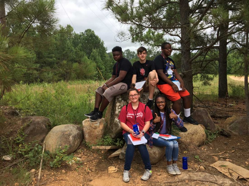 University of Arkansa at Little Rock Geology Camp participants visit Bayou Meto during a June 13 field excursion to practice geological mapping. Pictured, from left to right, back row: Ra'Maun Baker, Jonathan Bailey, and Fredrick Carthon. Front row: Hailey Nearns and Nyala Jefferson.