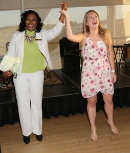 Cassandra Steele (left) celebrates Madison White's (right) acceptance of a job offer as a speech-language pathologist with the Little Rock School District. Photo by Nelson Cheanault. 