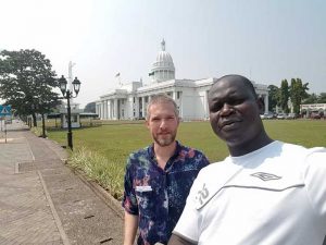 Eric Wiebelhaus-Brahm visits the Sri Lankan parliament building with colleague Stephen Oola.