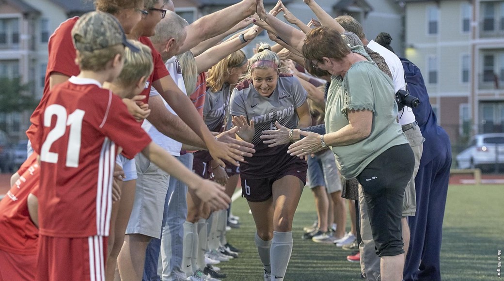 Fans cheer on a UA Little Rock soccer player.