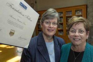 Linda Holzer (left) donates a certificate honoring Florence Price as a Music Teachers National Association Foundation Fellow Award recipient to Deborah Baldwin (right) at the Center for Arkansas History and Culture. Photo by Ben Krain.