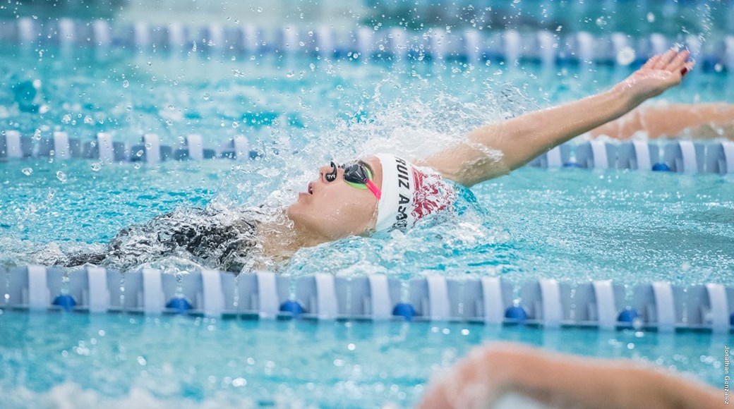 A member of the 2018 swimming and diving team competes.