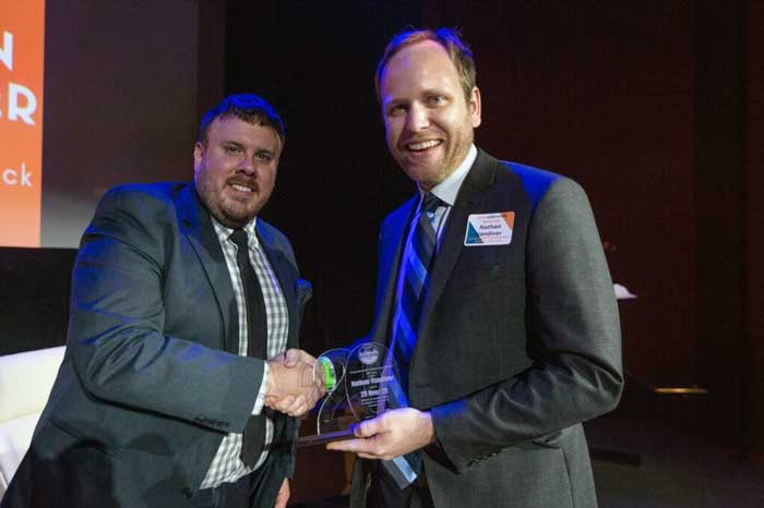 YNPN-LR Board Chair James Rector awards Nathan Vandiver (right) YNPN's 20 over 20 Award.