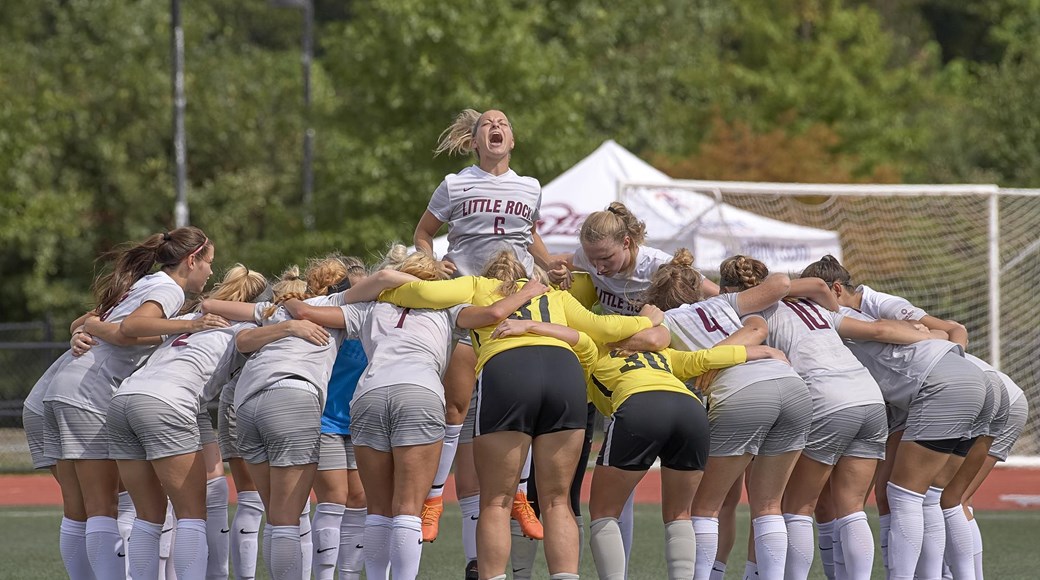 The UA Little Rock soccer teams cheers before a game.