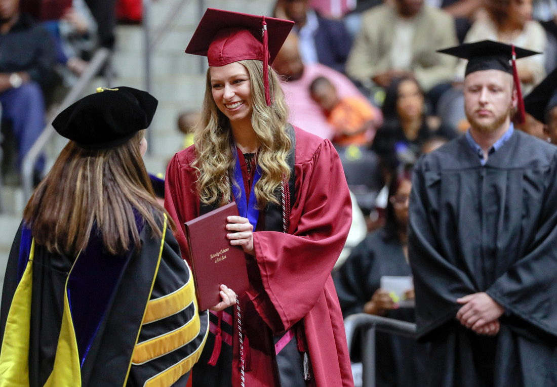 UA Little Rock Donaghey Scholars Ingrid Helgestad receives her diploma during the spring 2019 commencement ceremony. Photo by Ben Krain.